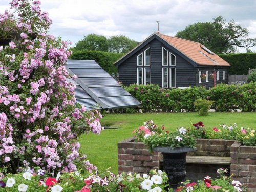 A solar thermal tracker heats the swimming pool and provides hot water for guests